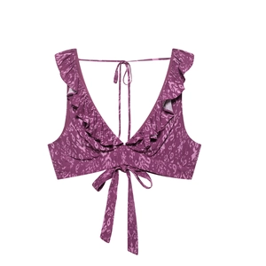 Close-up of purple leopard print bikini top with ruffles and front bow tie detail