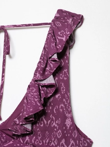 Detail of ruffled shoulder strap on a deep purple floral printed summer dress