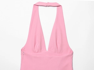 Detail view of pink halter neck midi dress with deep V-neckline and invisible side zipper