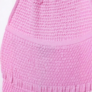 Sleeveless pink knitted dress for women with smocked design and waffle texture details