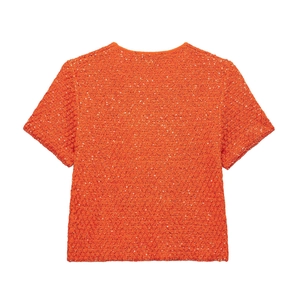 Bright orange short sleeve knit top featuring all-over sequins and a classic round neck