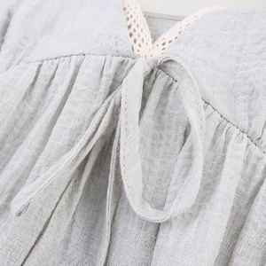 Light gray cotton linen blouse with V-neck lace trim and elegant drawstring details