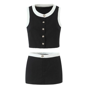 Two-piece black and white contrast sleeveless top and mini skirt set with pearl buttons