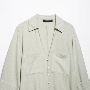 Minimalist light green linen shirt dress with V-neck and pockets for summer wear