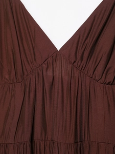 Detail of V-neckline and pleated texture on this chocolate brown tiered dress fabric