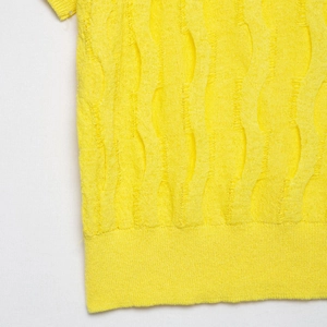 Short sleeve cable knit sweater in bright yellow with artistic textured hollow pattern