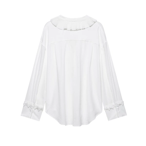 Detail view of white loose-fit shirt back with ruffle collar and bow cuffs