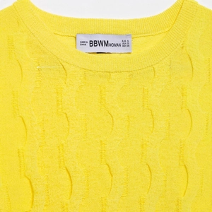 Women's bright yellow cable knit top with round neck and textured wave patterns
