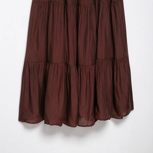 Elegant deep coffee tiered V-neck dress with lightweight pleated layers and glossy finish