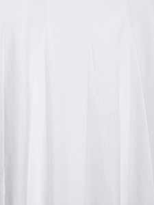 Close-up of white pleated midi dress fabric showing fine texture and vertical folds