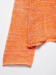 Detailed close-up of orange and white knit texture on casual hollow out sweater sleeve