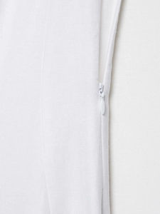 Detail view of the hidden side zipper closure on a white woven midi dress