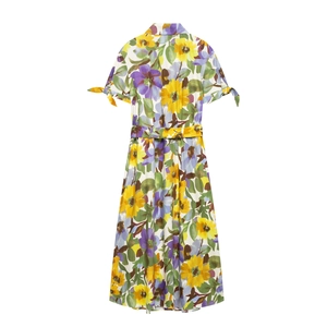Women's floral print short sleeve dress with V-neck, waist belt and bow tie cuffs