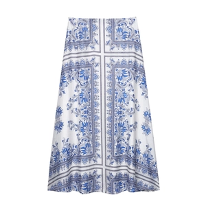 Elegant white A-line midi skirt featuring vintage blue floral prints and geometric patterns