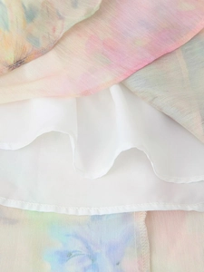 Detailed close-up of floral tie-dye fabric with breathable lining and neat hem stitching