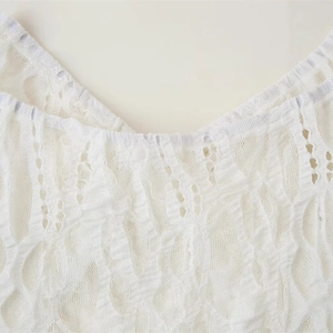 Elegant white lace layered dress featuring intricate hollow-out floral crochet details