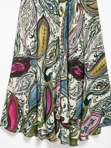 Detail shot of multicolor Paisley print on off-white bohemian style dress fabric