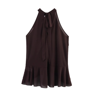 Detail of dark chocolate halter top showing chiffon fabric, neck bow, and ruffled hemline