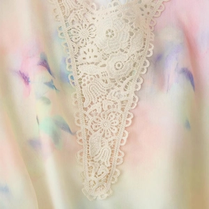 Summer tie-dye dress with delicate v-neck lace embroidery and pastel floral print detail