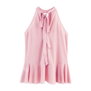 Detail of light pink halter top featuring bow neck tie and peplum ruffled hemline
