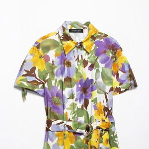 Floral short-sleeved V-neck shirt dress with belted waist and vibrant summer print