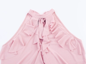 Detail shot of pink halter neck top showing elegant layered ruffles and soft chiffon fabric