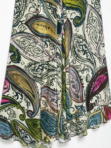 Close-up of lightweight paisley floral print dress with elegant draping silk fabric