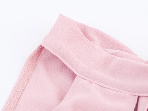 Detail of pink chiffon top showing high-quality stitching and breathable fabric texture