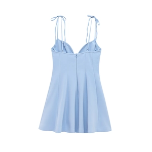 Back view of light blue mini strap dress showing the hidden zipper and V-neckline detail