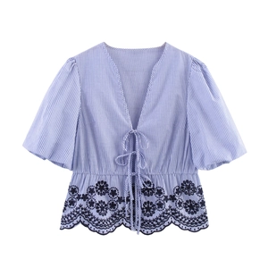 Women's blue and white striped blouse with V-neck tie, puff sleeves and floral lace hem