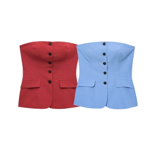 Close-up of strapless button-up tops in burgundy and light blue with flap pockets