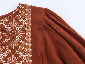 Detailed embroidery and pleats on rust red bohemian summer dress with neck ties