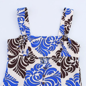 Women's summer dress with blue paisley print, dual shoulder straps, and button bodice details