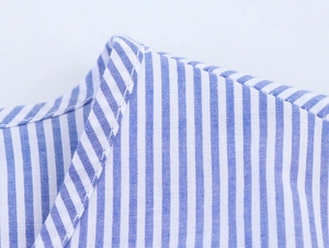 Close-up of the blue and white vertical striped shirt collar with detailed stitching
