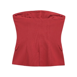 Detailed view of red strapless corset top with structured seams and flap pockets