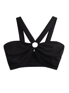 Detail of a black halter top with crossed straps and a central metal ring accent