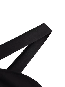 Detailed macro shot of durable black shoulder straps with high-density fabric stitching