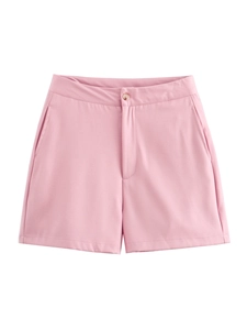 Detail of pink sleeveless suit shorts with zip fly, button closure and slanted pockets