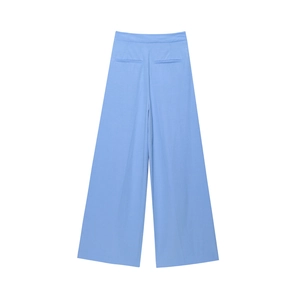 Detail view of light blue wide-leg trousers showing rear pockets and tailored woven fabric