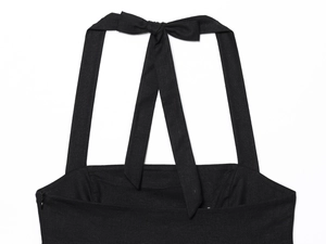 Detailed view of black halter neck tie and bowknot on woven fabric dress