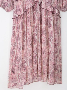 Detail of floral paisley print and layered ruffles on lightweight chiffon dress