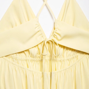 Elegant backless lemon yellow summer dress with cross straps and drawstring detail
