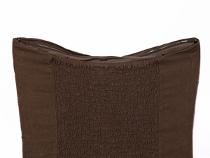 Detail view of the smocked elastic back and invisible zipper on a brown tube top