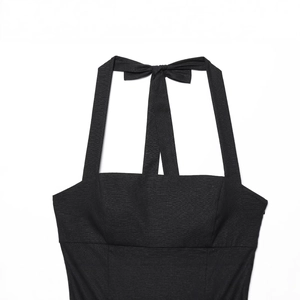 Elegant black halter mini dress with square neck and bow tie back detail on white background