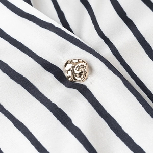Vertical striped satin shirt featuring a unique gold irregular-shaped button detail