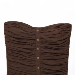 Deep brown ruched tube top with vertical button detailing and textured fabric finish