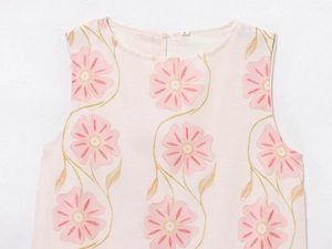 Detailed close-up of the floral print sleeveless top with round neck and S-size label