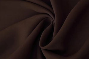 Detailed macro view of chocolate brown textile fabric texture and premium drape effect