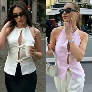 Chic halter neck tops for women featuring bow accents and cut-out details in white and pink