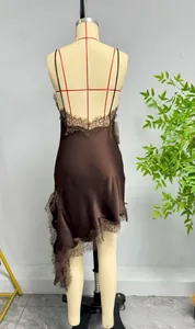 Detail of dark brown satin dress featuring backless cut and delicate eyelash lace trim